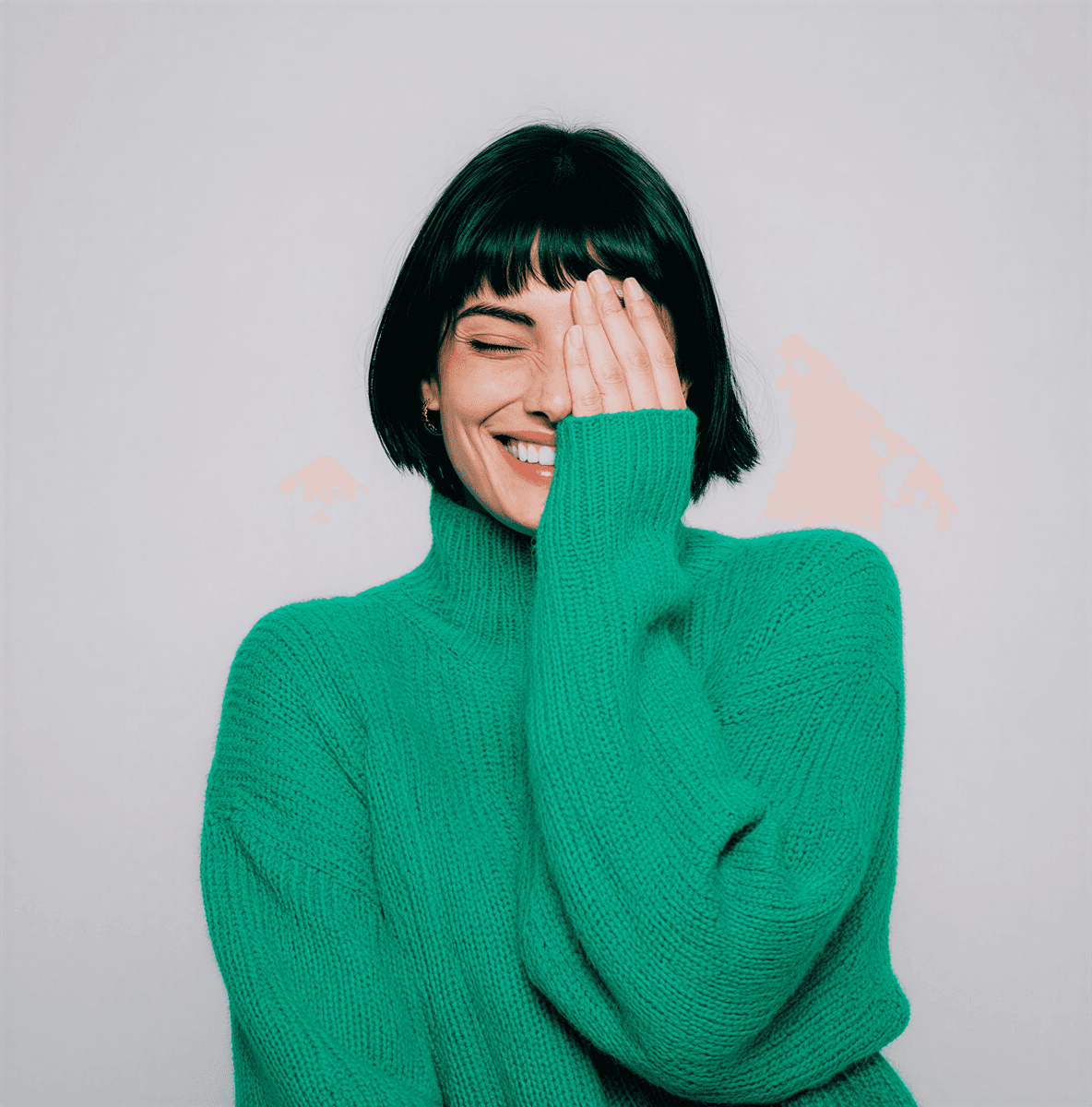 Woman in green sweater laughing